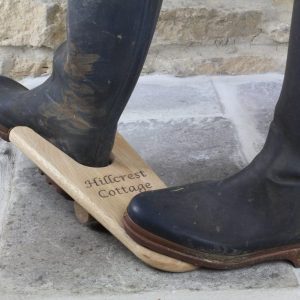 Personalised Wooden Oak Boot Jack in use