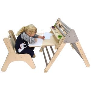 Thea drawing at Junior Pikler Desk